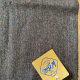 Wider shot of herringbonne tweed with maker's label