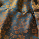 copper flowers on petrol background with copper sheen