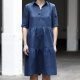 Front-view photo of woman wearing Avery, a shirtdress with a two-tiered gathered skirt, in dark blue.