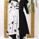Front-view photo of the Cruella Coat on a dress form.