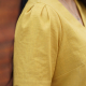 Detail image of short sleeve, with pleats in sleave head
